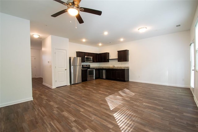 kitchen with sink, dark hardwood / wood-style flooring, ceiling fan, stainless steel appliances, and dark brown cabinetry