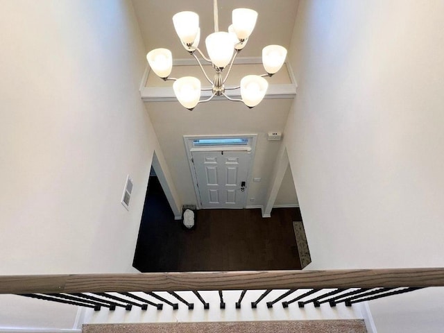 799 Blue Juniper Cir, Loganville, GA 30052 - stairs with an inviting chandelier and visible vents