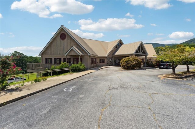 view of front of house with metal roof and a mountain view