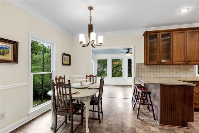 130 Wayne Wheeler Way, Woodstock, GA 30188 - dining room featuring crown molding, a chandelier, and a ceiling fan