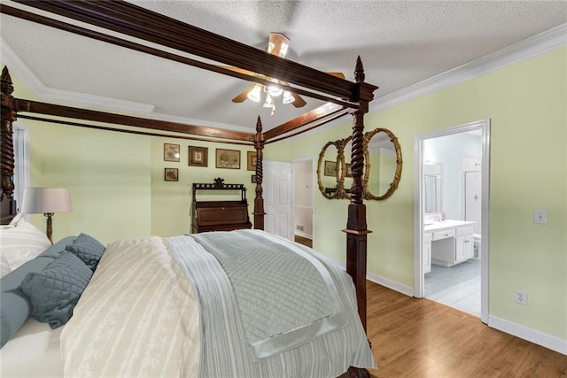 130 Wayne Wheeler Way, Woodstock, GA 30188 - bedroom featuring crown molding, light wood-style floors, a textured ceiling, ensuite bathroom, and ceiling fan