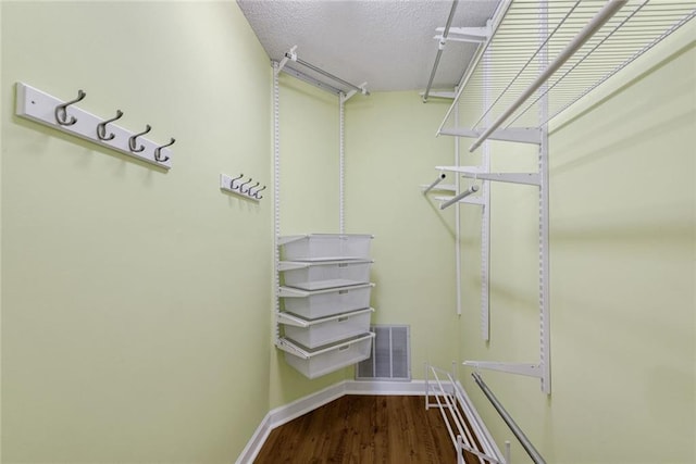 130 Wayne Wheeler Way, Woodstock, GA 30188 - walk in closet with wood finished floors
