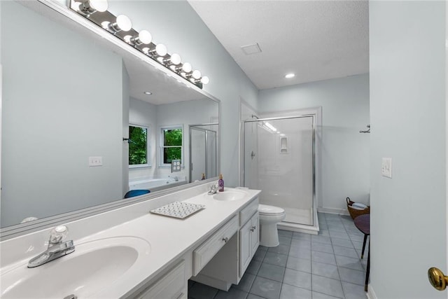 130 Wayne Wheeler Way, Woodstock, GA 30188 - bathroom featuring a stall shower, tile patterned floors, a garden tub, double vanity, and a textured ceiling