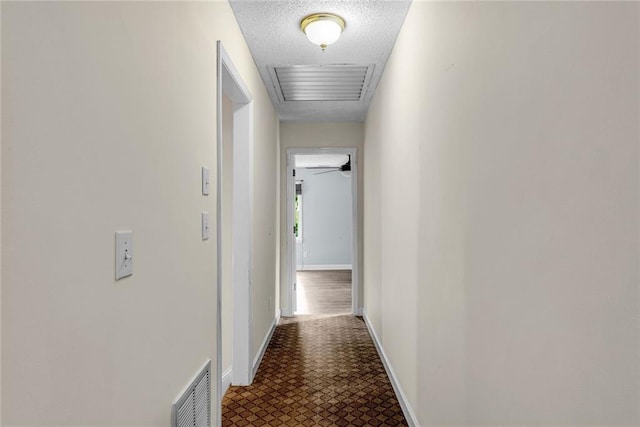130 Wayne Wheeler Way, Woodstock, GA 30188 - corridor featuring tile patterned floors and a textured ceiling