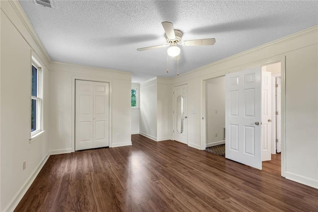 130 Wayne Wheeler Way, Woodstock, GA 30188 - unfurnished bedroom featuring wood finished floors, a textured ceiling, a ceiling fan, and crown molding