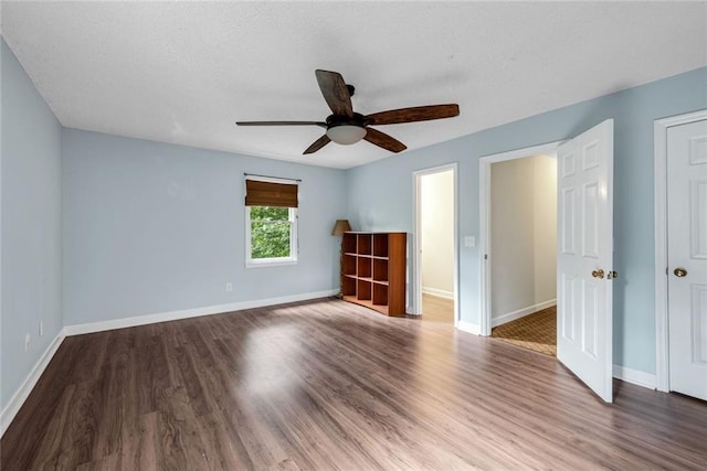 130 Wayne Wheeler Way, Woodstock, GA 30188 - unfurnished bedroom with wood finished floors and ceiling fan