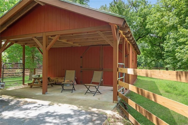 130 Wayne Wheeler Way, Woodstock, GA 30188 - view of patio / terrace featuring an outbuilding