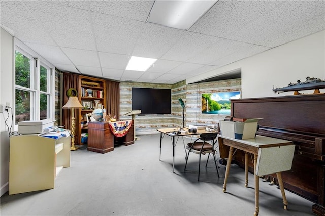 130 Wayne Wheeler Way, Woodstock, GA 30188 - living area featuring concrete flooring, a paneled ceiling, and wooden walls