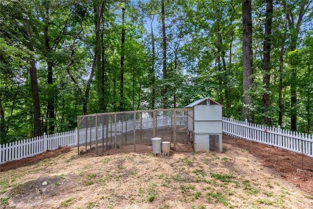130 Wayne Wheeler Way, Woodstock, GA 30188 - fenced backyard featuring exterior structure and an outbuilding