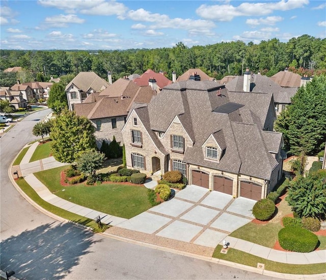 birds eye view of property with a residential view