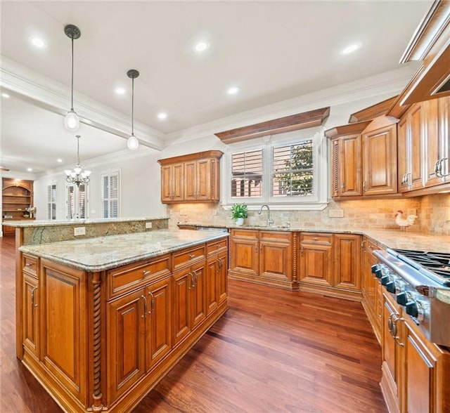 kitchen with dark wood-style floors, stainless steel gas stovetop, a sink, and light stone countertops