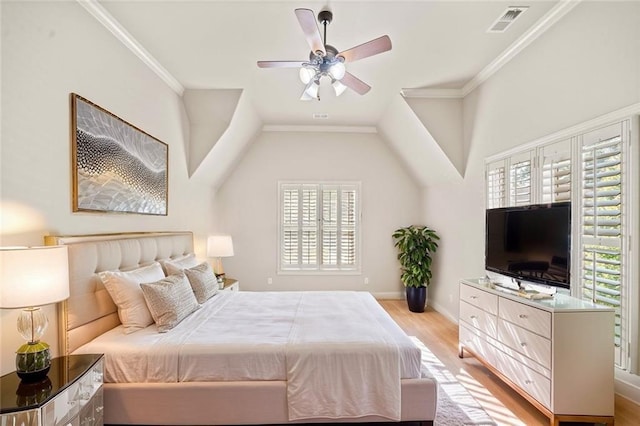 bedroom with visible vents, multiple windows, ornamental molding, and wood finished floors