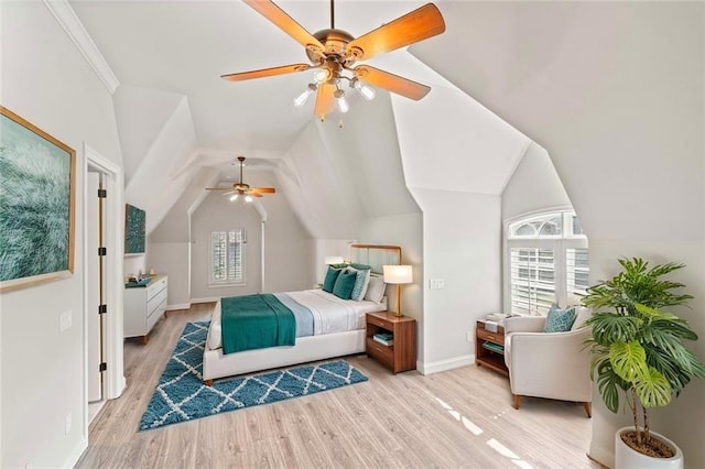 bedroom with lofted ceiling, ceiling fan, light wood-type flooring, and baseboards