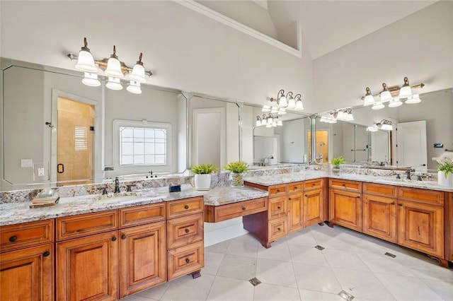 bathroom with high vaulted ceiling, tile patterned flooring, a shower stall, and vanity