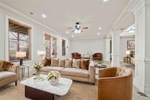 living room featuring decorative columns, recessed lighting, visible vents, ornamental molding, and ceiling fan