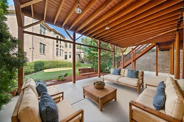 view of patio with stairway and an outdoor living space