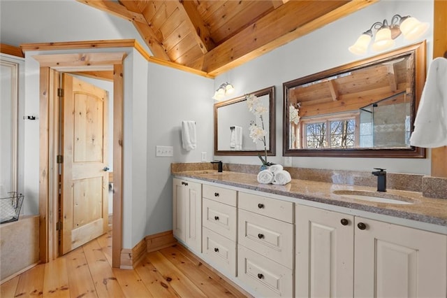8850 Matt Hwy, Ball Ground, GA 30107 - full bath featuring wood ceiling with exposed beams, double vanity, hardwood / wood-style floors, and baseboards