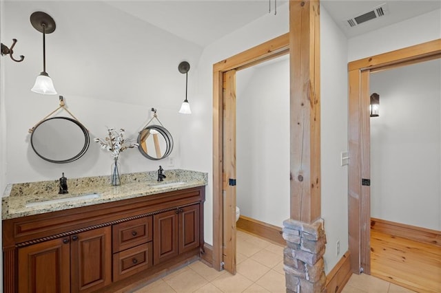8850 Matt Hwy, Ball Ground, GA 30107 - full bath with double vanity, tile patterned floors, toilet, and baseboards