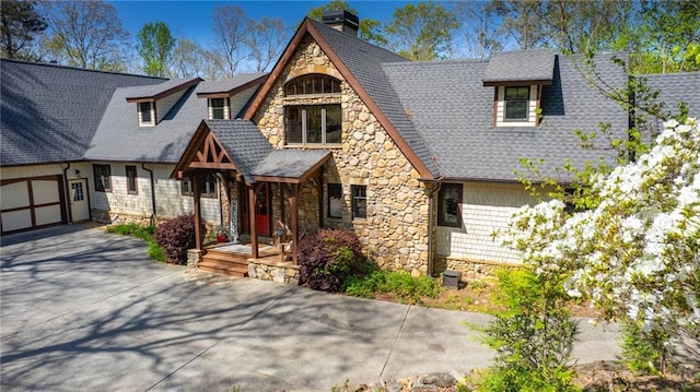 8850 Matt Hwy, Ball Ground, GA 30107 - view of front facade featuring stone siding, concrete driveway, and a chimney