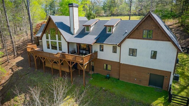 8850 Matt Hwy, Ball Ground, GA 30107 - rear view of property featuring a chimney, a deck, central air condition unit, view of scattered trees, and a shingled roof