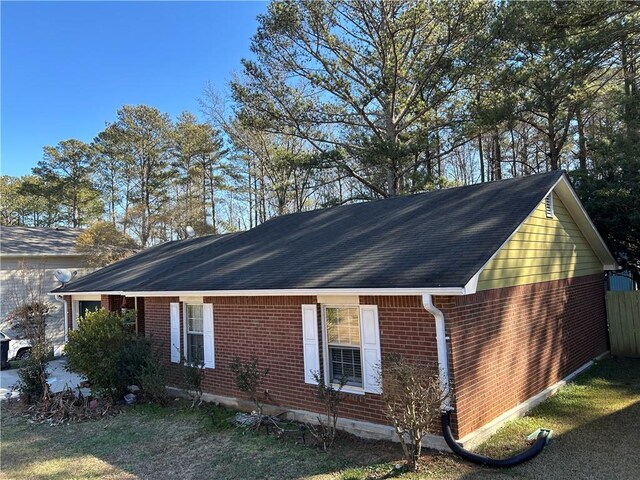 single story home with a garage and covered porch