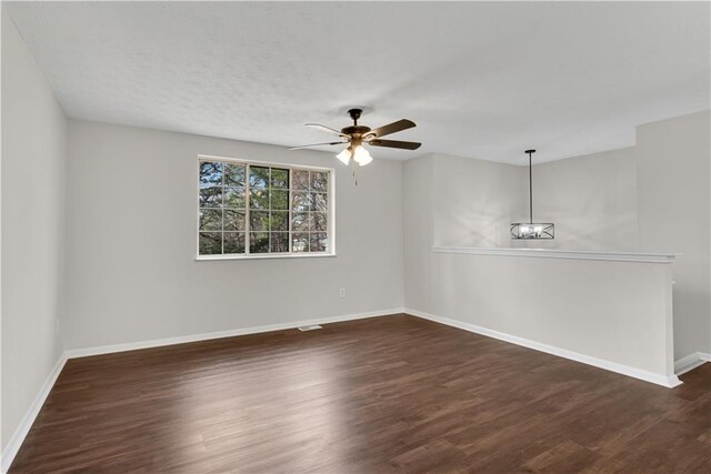 3414 Dearwood Dr SW, Lilburn, GA 30047 - hall with dark wood-style floors, baseboards, and a textured ceiling