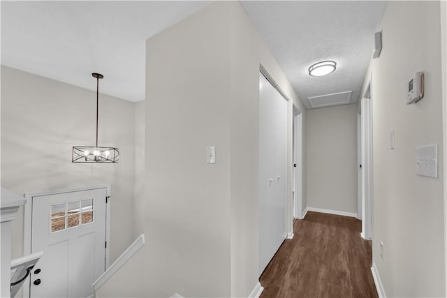 3414 Dearwood Dr SW, Lilburn, GA 30047 - hall featuring baseboards, an upstairs landing, and dark wood finished floors