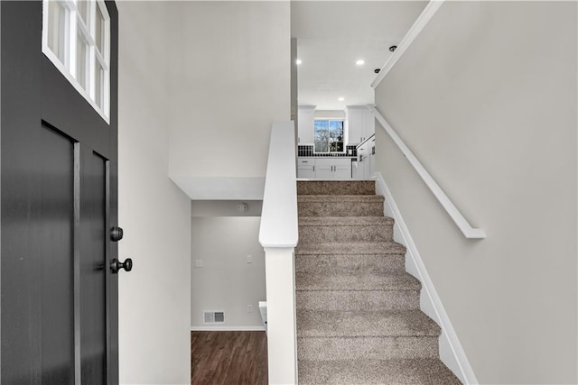 3414 Dearwood Dr SW, Lilburn, GA 30047 - stairway with recessed lighting, wood finished floors, and baseboards
