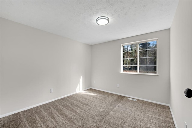 3414 Dearwood Dr SW, Lilburn, GA 30047 - spare room with carpet floors, baseboards, and a textured ceiling