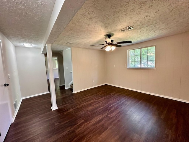 3414 Dearwood Dr SW, Lilburn, GA 30047 - spare room featuring wood finished floors, a textured ceiling, ceiling fan, baseboards, and stairs