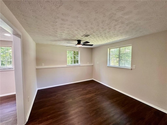 3414 Dearwood Dr SW, Lilburn, GA 30047 - unfurnished room with wood finished floors, baseboards, a textured ceiling, and ceiling fan