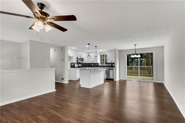 3414 Dearwood Dr SW, Lilburn, GA 30047 - unfurnished room with ceiling fan, dark wood-type flooring, and baseboards