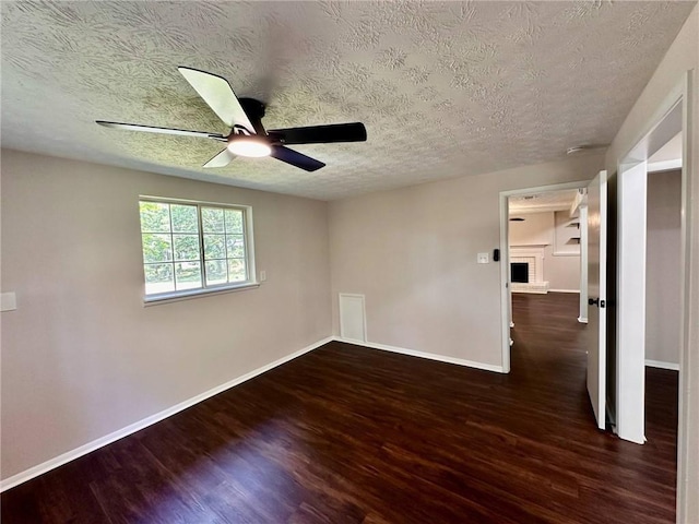 3414 Dearwood Dr SW, Lilburn, GA 30047 - unfurnished room featuring wood finished floors, a textured ceiling, a ceiling fan, and baseboards