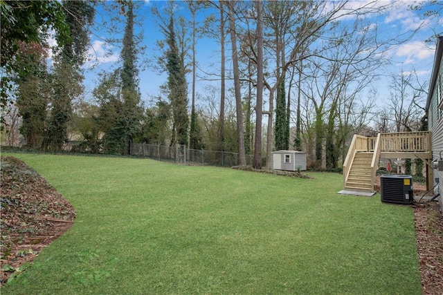 3414 Dearwood Dr SW, Lilburn, GA 30047 - view of yard featuring stairway, a deck, and central air condition unit
