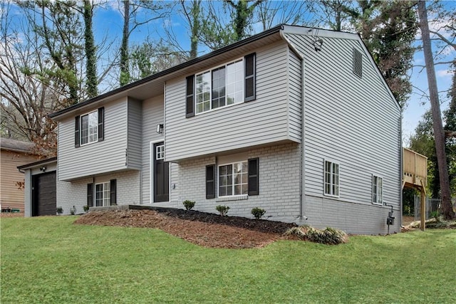 3414 Dearwood Dr SW, Lilburn, GA 30047 - split foyer home featuring brick siding, a garage, and a front lawn