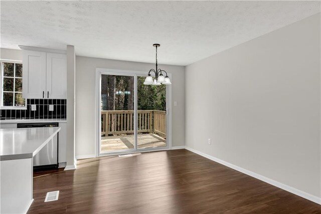 3414 Dearwood Dr SW, Lilburn, GA 30047 - kitchen with stainless steel appliances, a sink, light countertops, tasteful backsplash, and dark wood finished floors