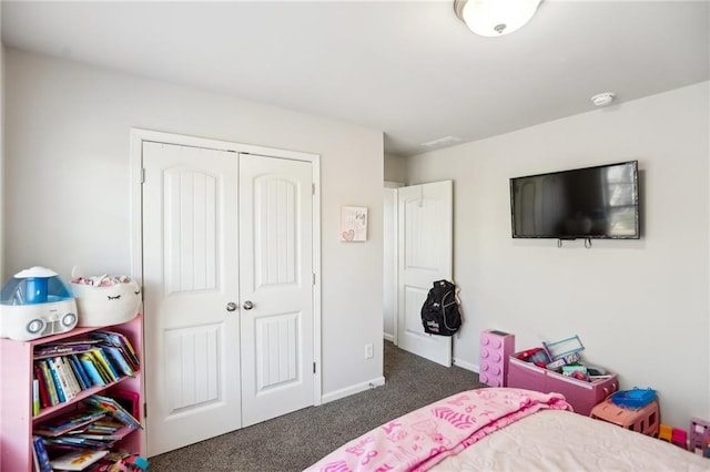 carpeted bedroom featuring a closet