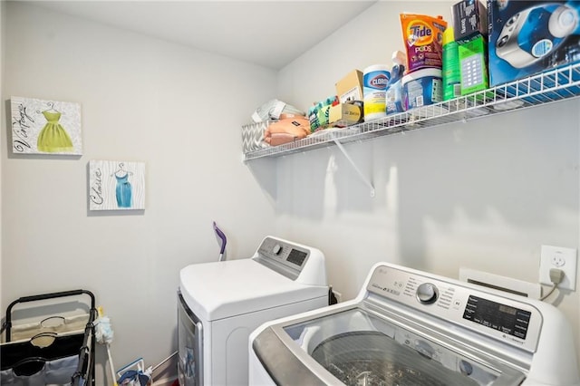 washroom with washing machine and dryer