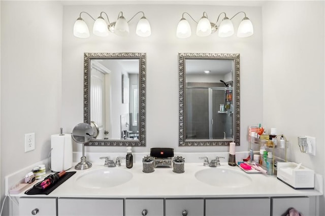 bathroom with walk in shower and vanity