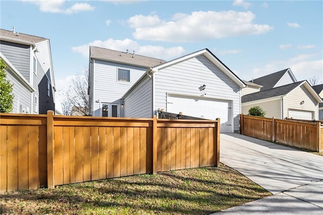 rear view of property featuring a garage