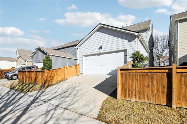 view of side of home featuring a garage