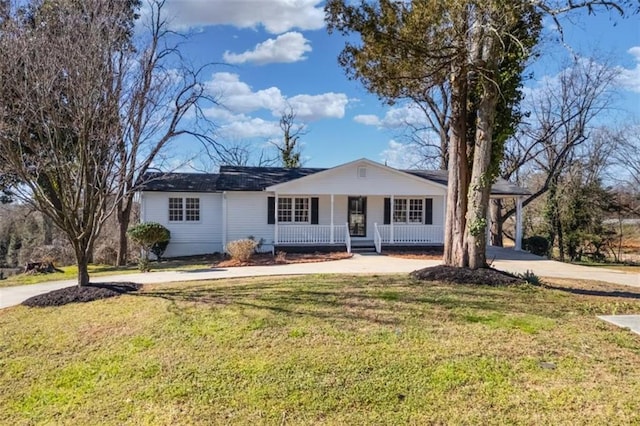 ranch-style home featuring a porch, a front lawn, and concrete driveway