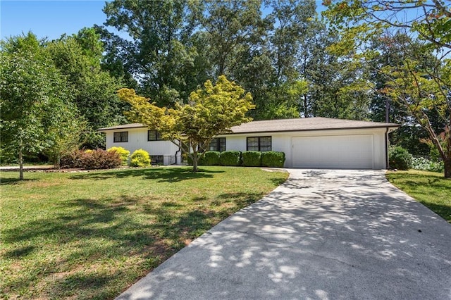 view of front facade with an attached garage, driveway, and a front lawn