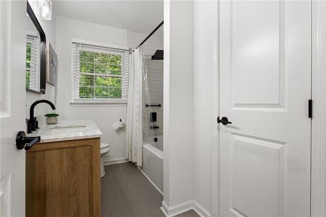 full bath featuring tile patterned flooring, baseboards, vanity, toilet, and shower / bath combo with shower curtain