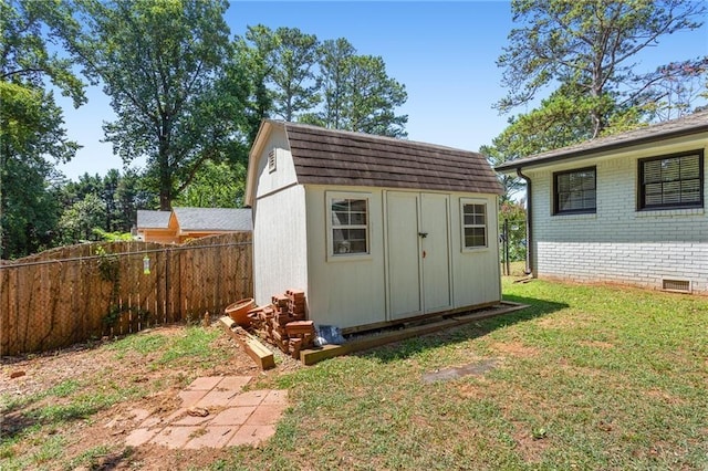 view of shed with fence