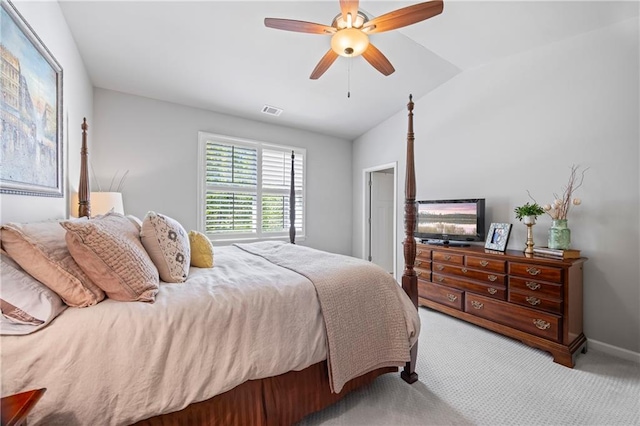 bedroom with light colored carpet, visible vents, vaulted ceiling, ceiling fan, and baseboards