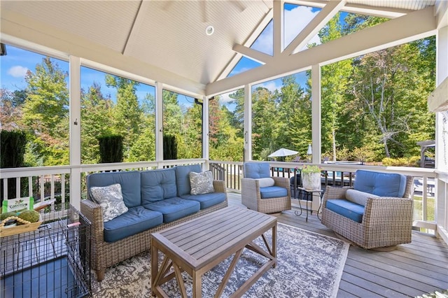 sunroom / solarium featuring vaulted ceiling