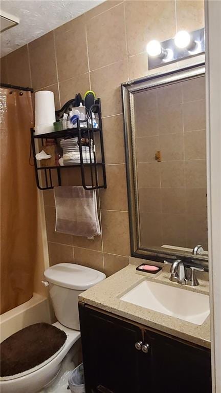 full bathroom with toilet, vanity, tile walls, decorative backsplash, and shower / bathtub combination with curtain