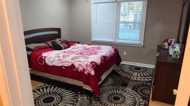 bedroom featuring baseboards