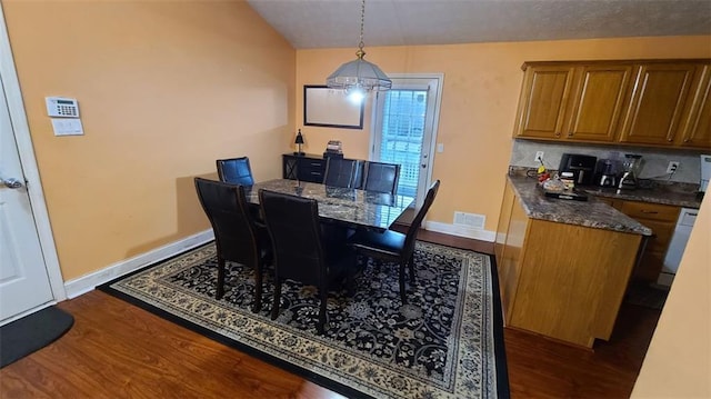 dining area with visible vents, dark wood finished floors, and baseboards